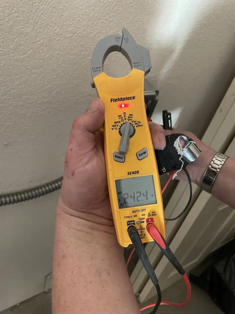 Voltage testing with clamp meter during Circuit Breaker Repair in Durham